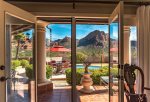 French doors open to poolside patio